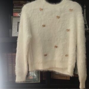 Stunning ad Elegant White Sweater with Gold Accents. Looks and feels like angora